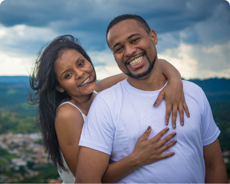 Two reviewers embracing and smiling outside.